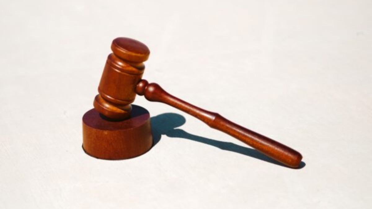 Wooden judge gavel on white background